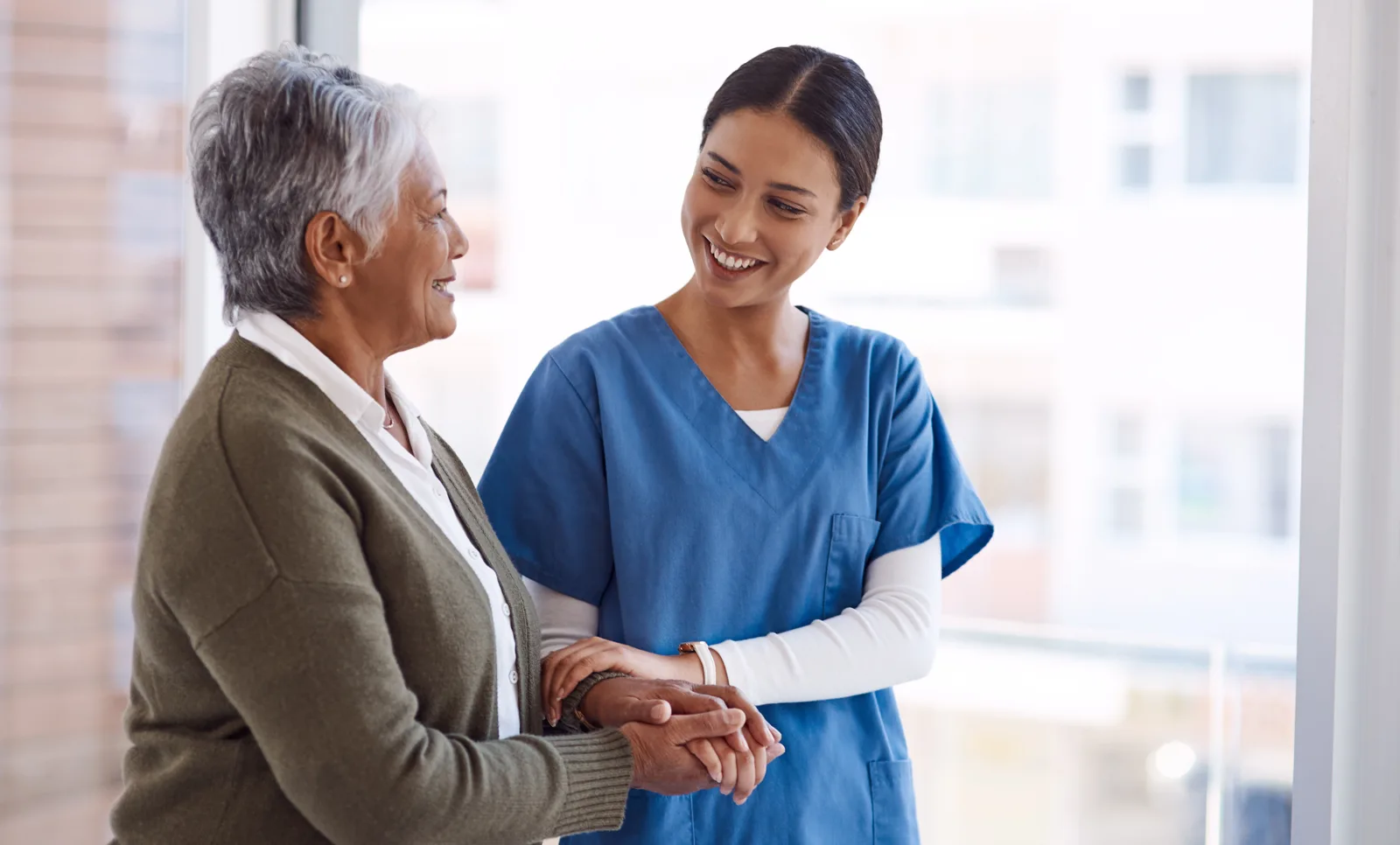 International nurse with a senior patient